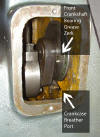 Grease zerk and crankcase breather port at front of crankshaft.