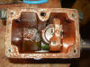 Forked slot in yoke allows sliding connection between yoke and pump plunger when actuating priming pump.