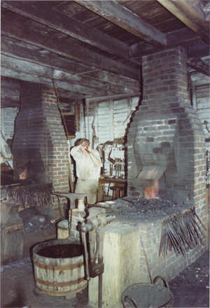 Side-draft forges in large addition of Anderson's Blacksmith Shop - Colonial Williamsburg, Virginia, USA