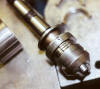 Split nut fits around threaded area of jaws