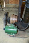 Motor mounted on slotted plate for easy adjustment