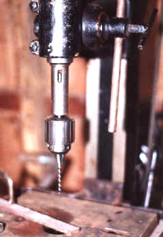 Morse Taper tang seen inside wedge slot of spindle socket.