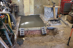 Concrete subfloor pouted for new brick floor.