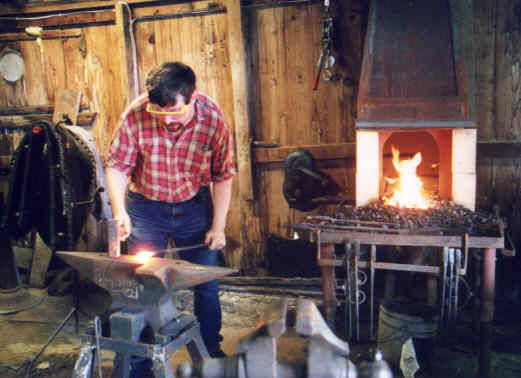 Steel side draft forge in use. Summer 2001.