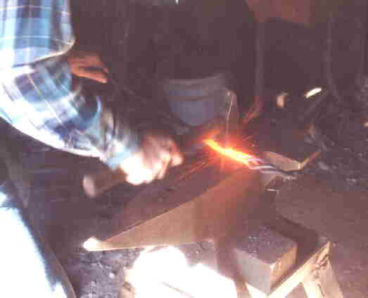 Welding a basket handle.